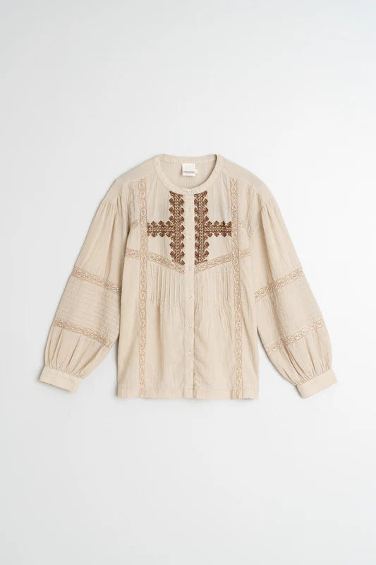 Beige blouse with floral embroidery on a white background