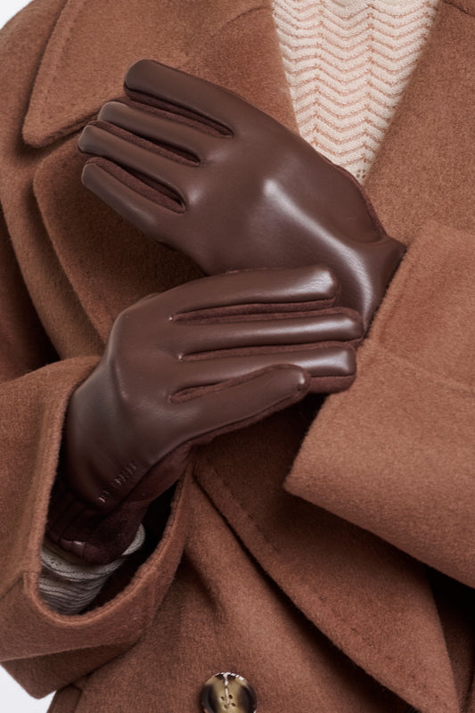 Rino & Pelle Fidelia faux leather gloves in Coffee Roast brown with suede-feel palm and heart fingertip detail, worn with a camel coat
