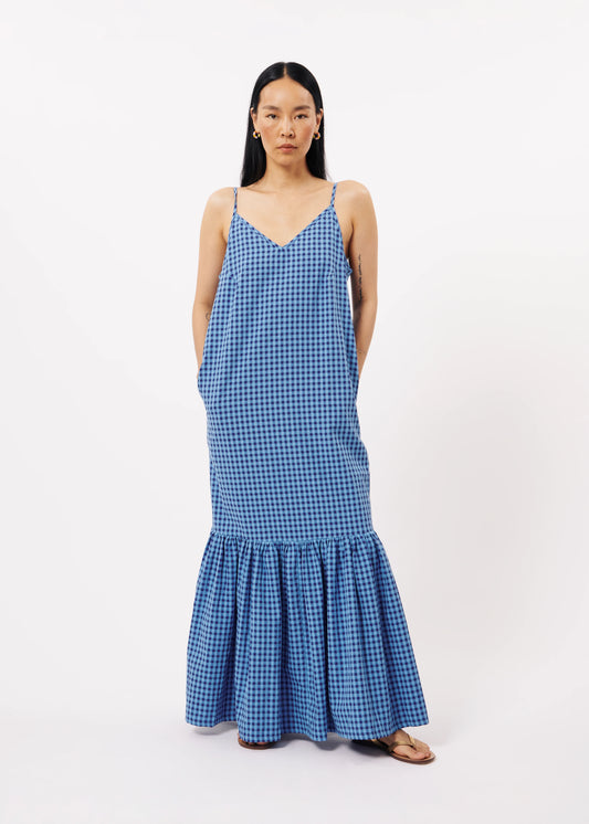 The FRNCH Neha Dress features a stylish Vichy gingham pattern in two tone blue and a straight, form-flattering cut, pockets and thin straps. Perfect for an effortless and chic look while out and about in town, day or night.