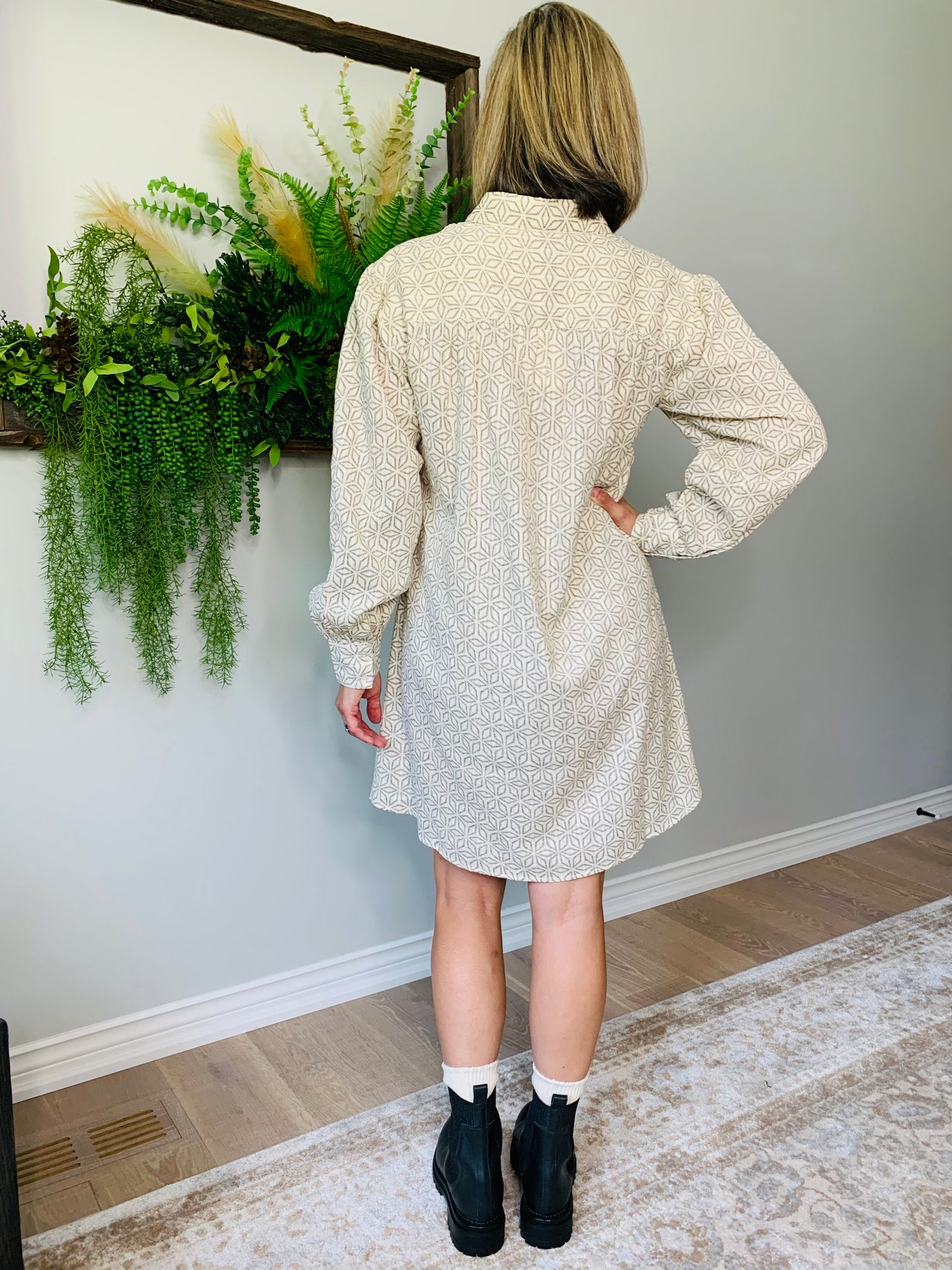 The Rena dress by FRNCH features a shirt collar, long balloon sleeves, and a button placket for a look that's comfortable and stylish. geometric pattern in black is woven into the cotton fabric with a cream background. lemon cyprus boutique