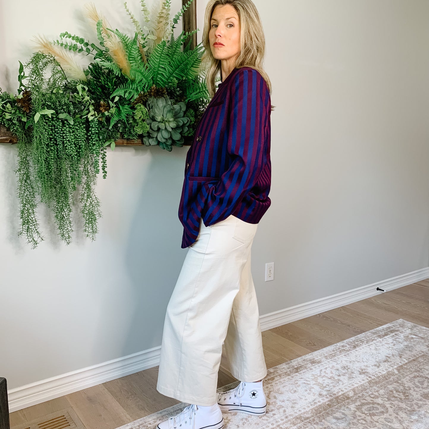 This double-breasted navy and burgundy striped blazer is oversized and totally versatile—so you can rock it with jeans, trousers, or even a skirt!