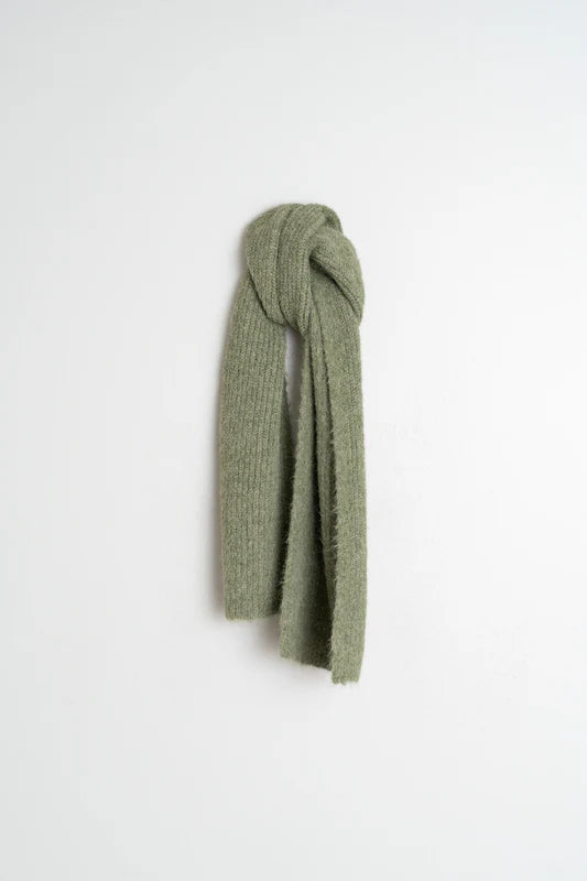 Green knitted scarf on a white background