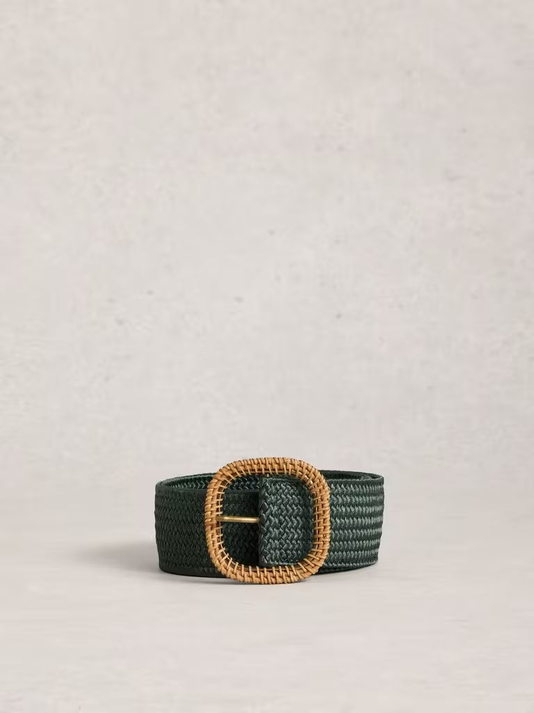 Green woven belt with a gold buckle on a light gray background