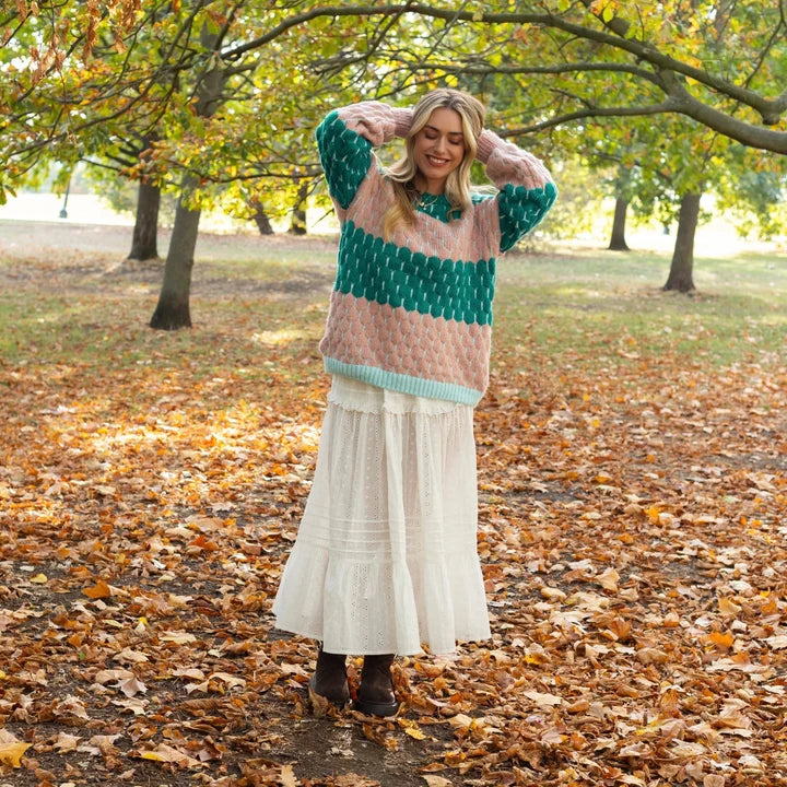 Marissa balloon sleeve sweater styled with a skirt and boots