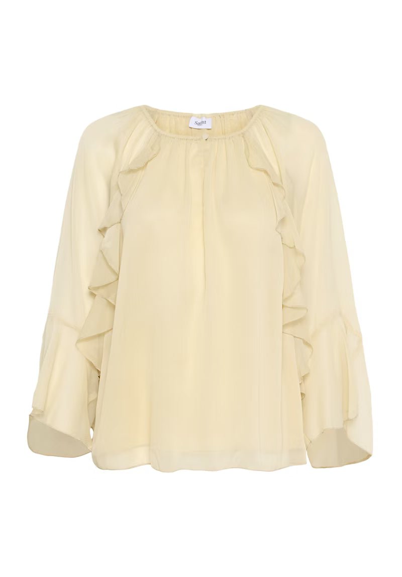 Light yellow blouse with ruffled sleeves on a white background