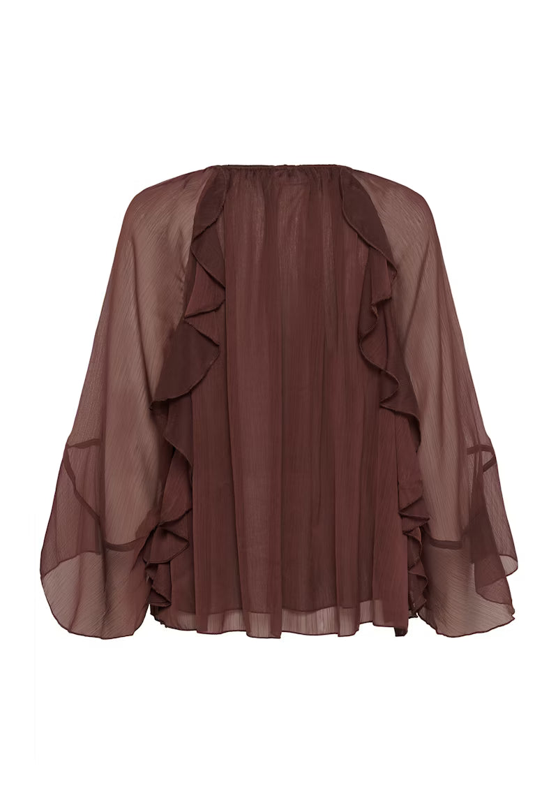 Brown sheer blouse with ruffled details on a white background