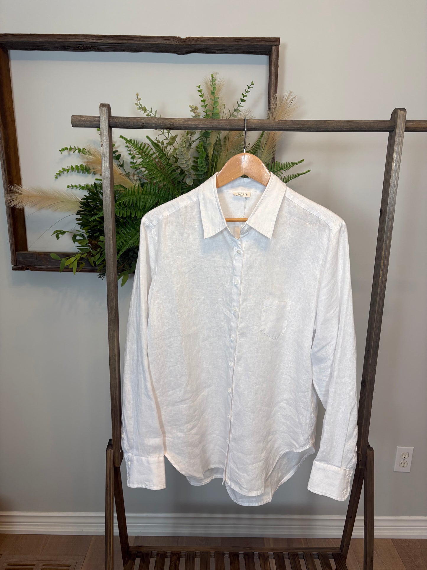 The Imogen Blouse by Naif is a white button-up shirt that belongs in every wardrobe. A true staple, this effortlessly chic piece is crafted from ultra-soft, lightweight woven linen for all-day comfort and breathability