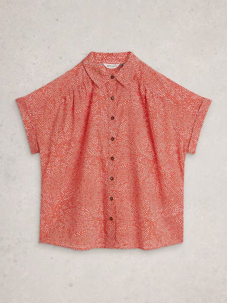 Red patterned shirt on a light gray background