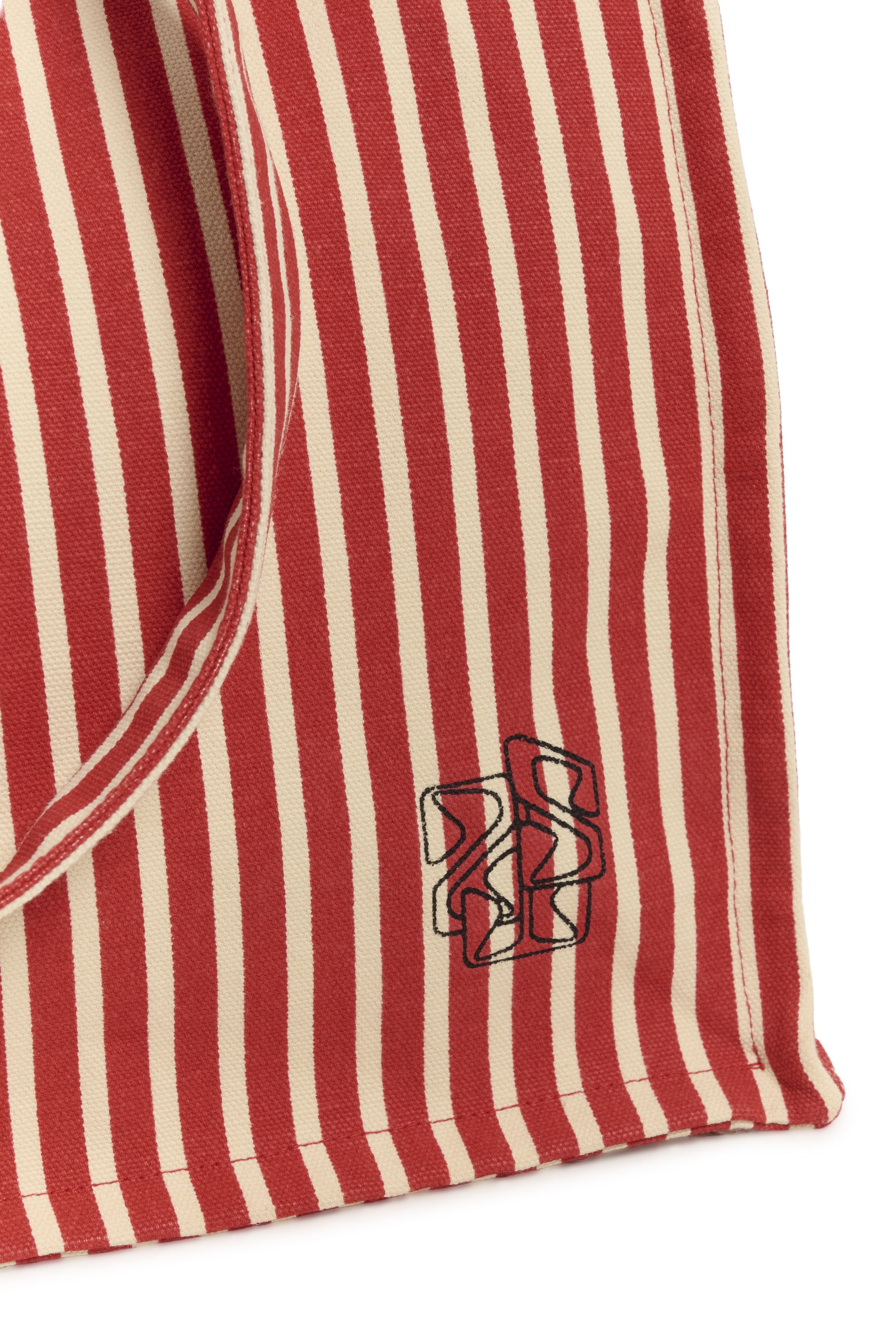 Red and white striped fabric with a logo on a white background