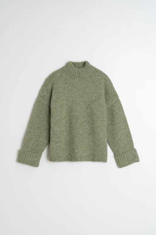 Green sweater on a white background