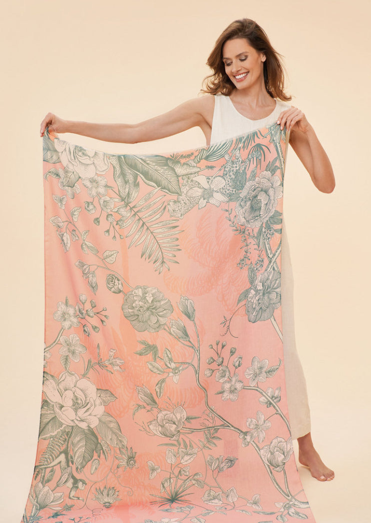 Discover the latest addition to Powder UK's collection, the Printed Floral Jungle Scarf in petal. Adorned with charmingly feminine florals and beloved jungle animals, this scarf exudes a luxurious and ethereal aesthetic. Ideal for the sophisticated and stylish individual, pair it with jeans and a top or a dress for a graceful and effortless ensemble.