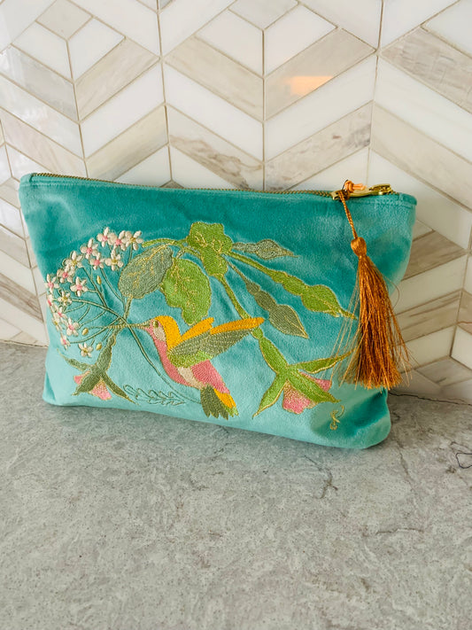 Look&nbsp;chic day-to-night! This&nbsp;Hummingbird design will have you feeling light and airy and dreaming of adventures.&nbsp;Powder Uk's&nbsp;Velvet Zip Pouches make a super gift and are hugely versatile. Carry down to evening drinks or keep in your hand luggage as an organiser.&nbsp;