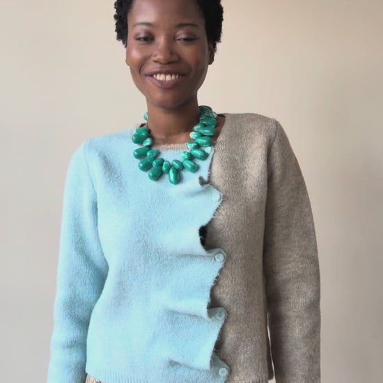 Blue Biscuit Cardigan by Dr Bloom, sky blue and beige colour-block knit cardigan with ruffle button front and orange neckline trim