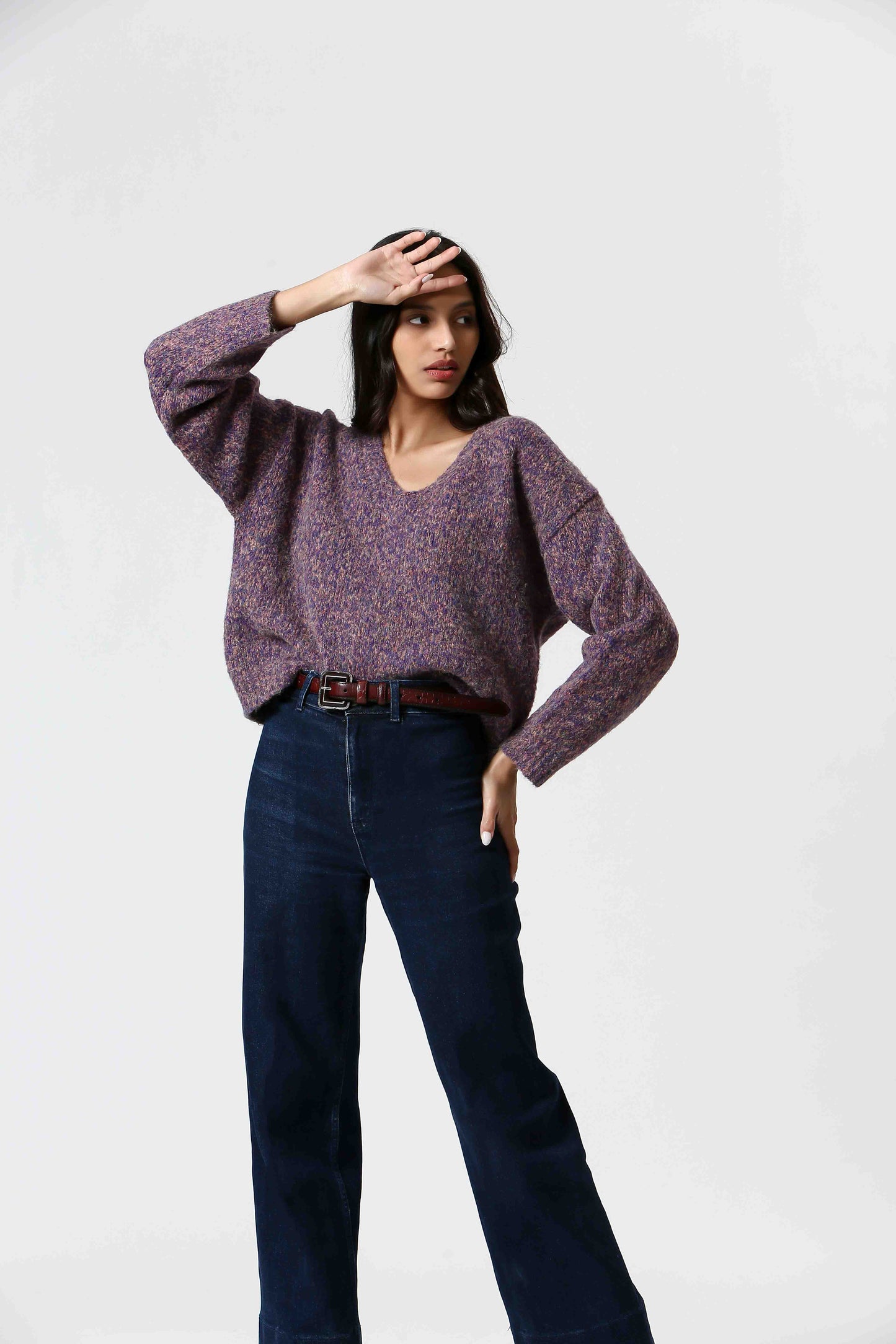 Get lost in the dreamy Purple Haze Sweater by The Korner. A melange of purple hues mixed with a touch of coral make this cozy v-neck a must-have. Perfect for adding a touch of cozy style to your wardrobe.