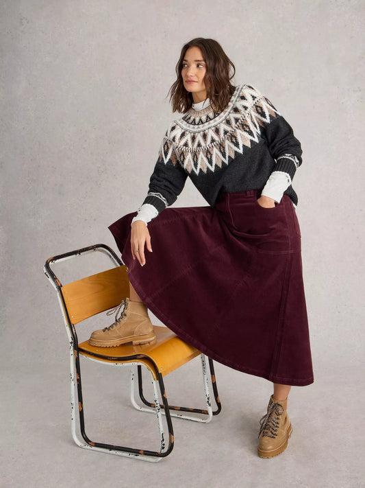 Revamp your wardrobe with The Quinn, a knee-high burgundy cord skirt from White Stuff. Its high waist and midi length make it the perfect addition to any outfit.