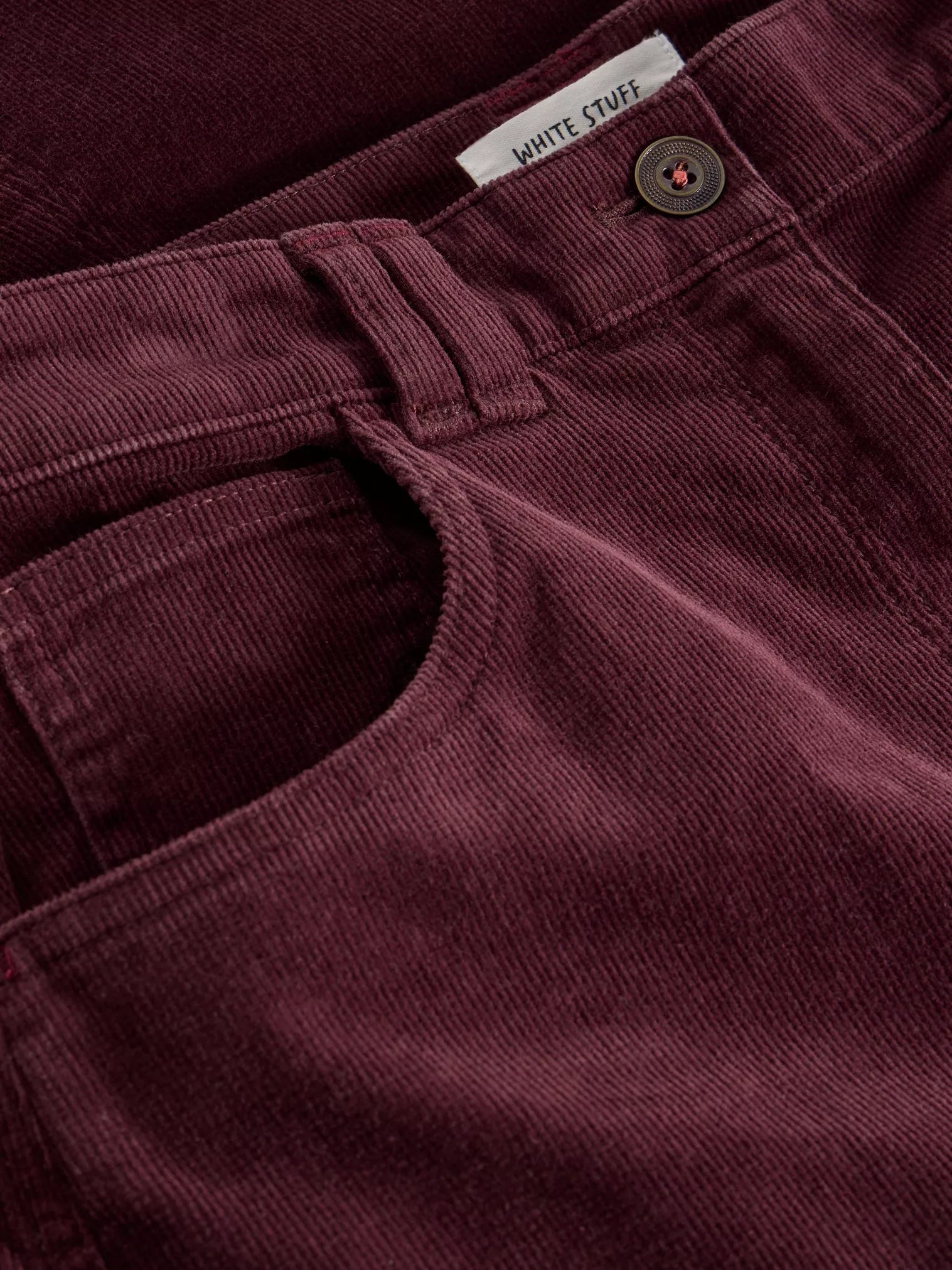 Revamp your wardrobe with The Quinn, a knee-high burgundy cord skirt from White Stuff. Its high waist and midi length make it the perfect addition to any outfit.