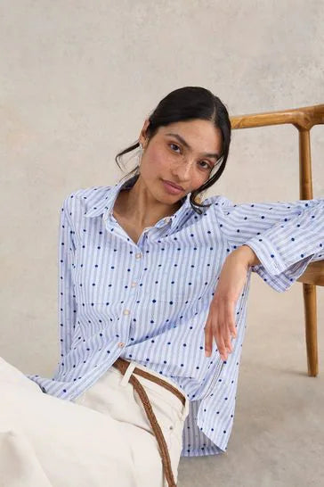 Revamp your button-up game with the Sophie Shirt by White Stuff - a fun and playful take on the classic white cotton shirt. Featuring blue pin stripes and embroidered dots in light and royal blue, it's an eye-catching piece that will instantly upgrade your wardrobe.