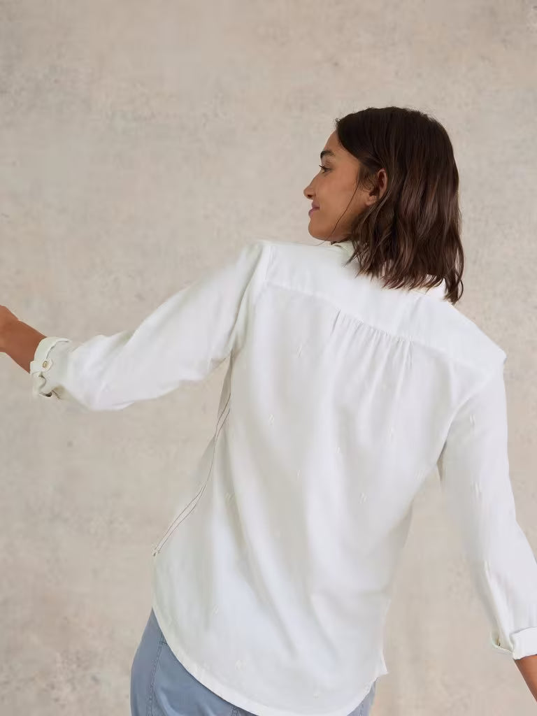 Meet the Sophie Organic Cotton Shirt by White Stuff in a soft pale ivory shade. With its playful contrast embroidery, this shirt is the fresh boost your button-up collection has been craving.