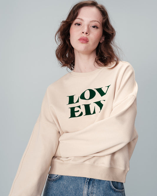 The&nbsp;NIGEL round neck sweatshirt by Grace &amp; Mila&nbsp;has a 'LOVELY' velvet print message in a beautiful hunter green on beige. Made from natural fibres, the warm and comfy&nbsp;NIGEL message sweater&nbsp;is a fall/winter essential. lemon cyprus boutique