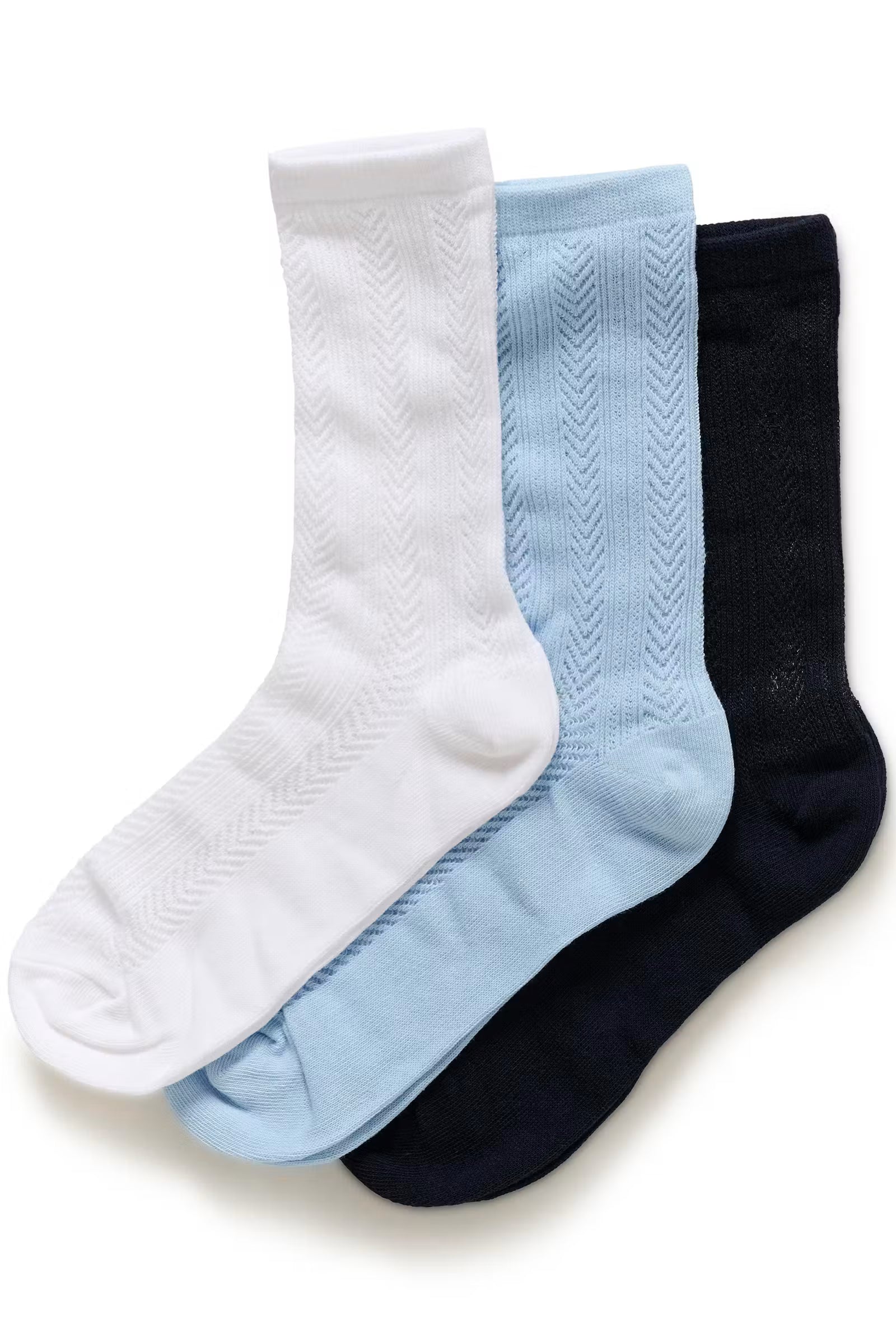 Three pairs of socks in white, light blue, and black on a white background