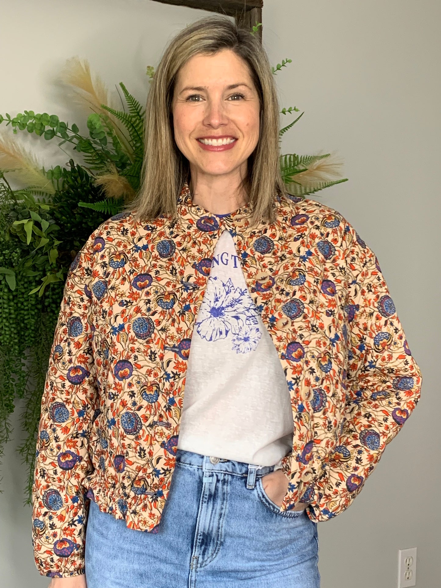 Introducing the Spring Time Graphic Tee by The Korner! This short-sleeved tee in white with blue trim on the arms and collar is a must-have for the season. With "spring time" and a floral picture, it's both stylish and comfy for everyday wear. Get yours now and embrace spring in style!