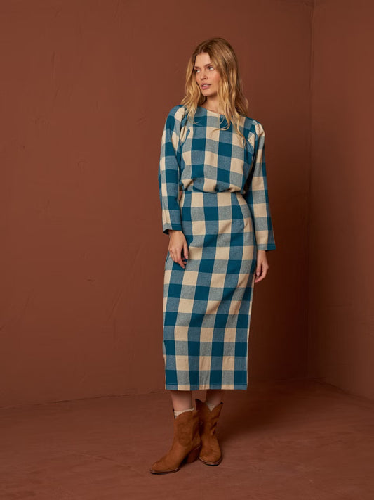 Get ready to be the talk of the town in our Vichy Check Skirt by Indi &amp; Cold! Made from 100% cotton flannel, this high waist skirt features a bold cream and teal gingham print. With a playful slit up the back, you'll add a touch of style to any outfit. Style with a blouse or a chunky sweater. 