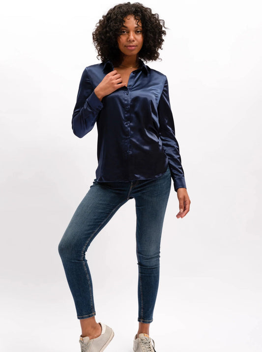 This rich midnight coloured Carmen shirt by We Are The Others is crafted for a lasting, polished look. Featuring our core Satin shirt fit, self-covered button detail at center front & cuff openings, and a shaped hem, this shirt guarantees a smart, sophisticated style. Embodying modern and timeless elements, this design offers an updated take on a classic look. lemon cyprus boutique