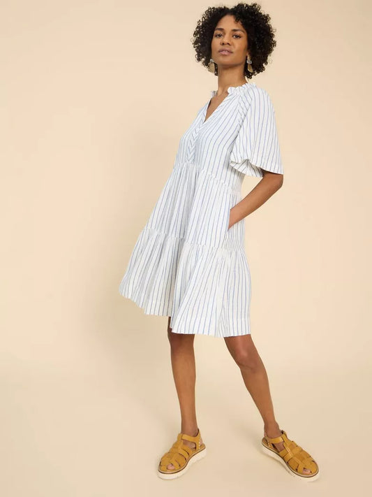 White dress with blue pin stripes. Stripey, tiered and definitely top of our ‘summer holidays essentials’ list.  Fabric: 100% VISCOSE LENZING ™ ECOVERO ™  Fit: Notch Neck, Short Sleeve, Relaxed, Midi, True to size  Care: Machine Washable. lemon cyprus boutique
