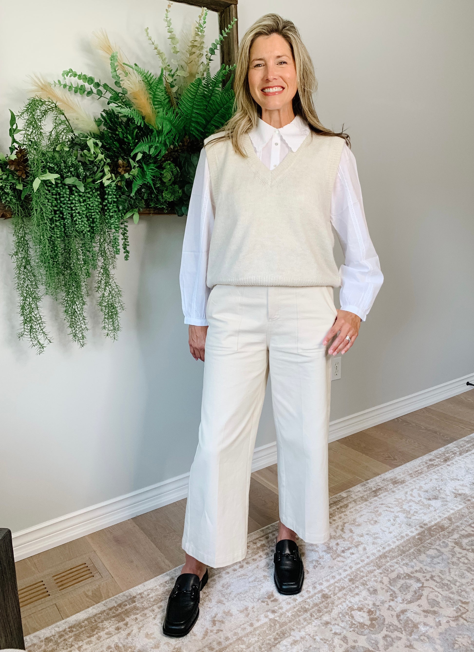 100% cotton white blouse. The scalloped detailing on the collar with the intricate and pleating details that run vertically down the front and arms of the blouse are stunning.